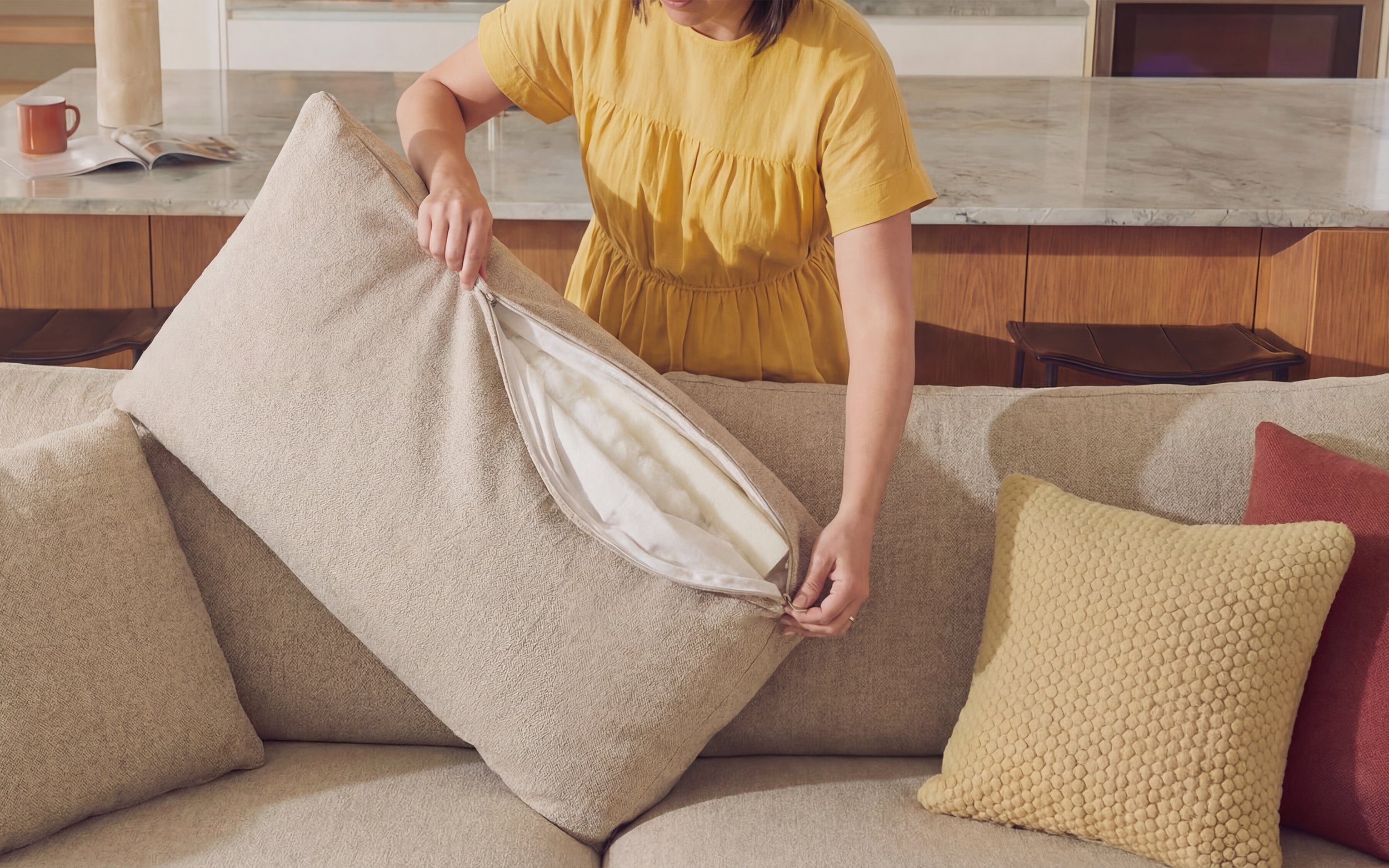 Firmed-up cloud couch cushions after the fluff routine