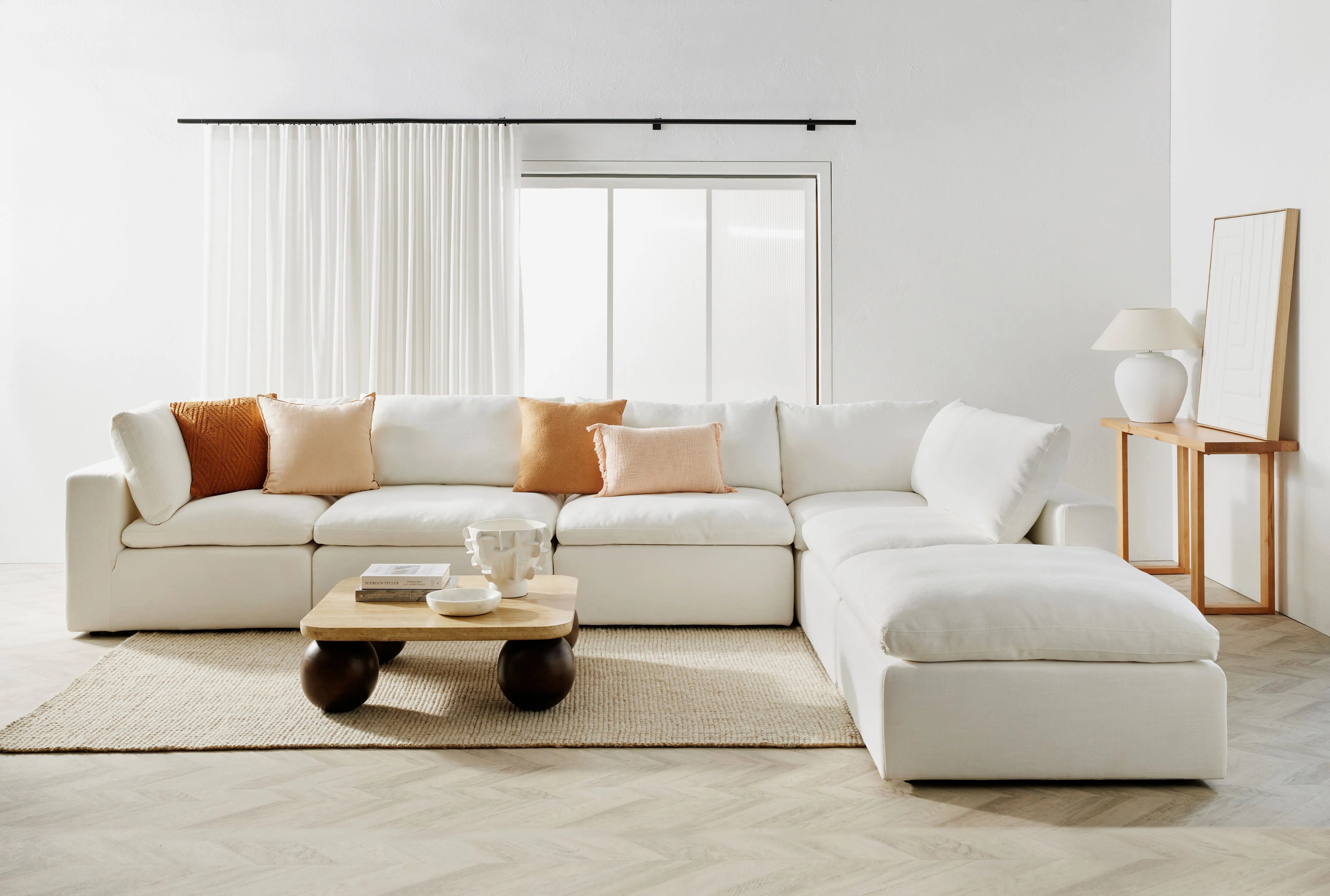 Beige L-Shaped sofa in clean white room