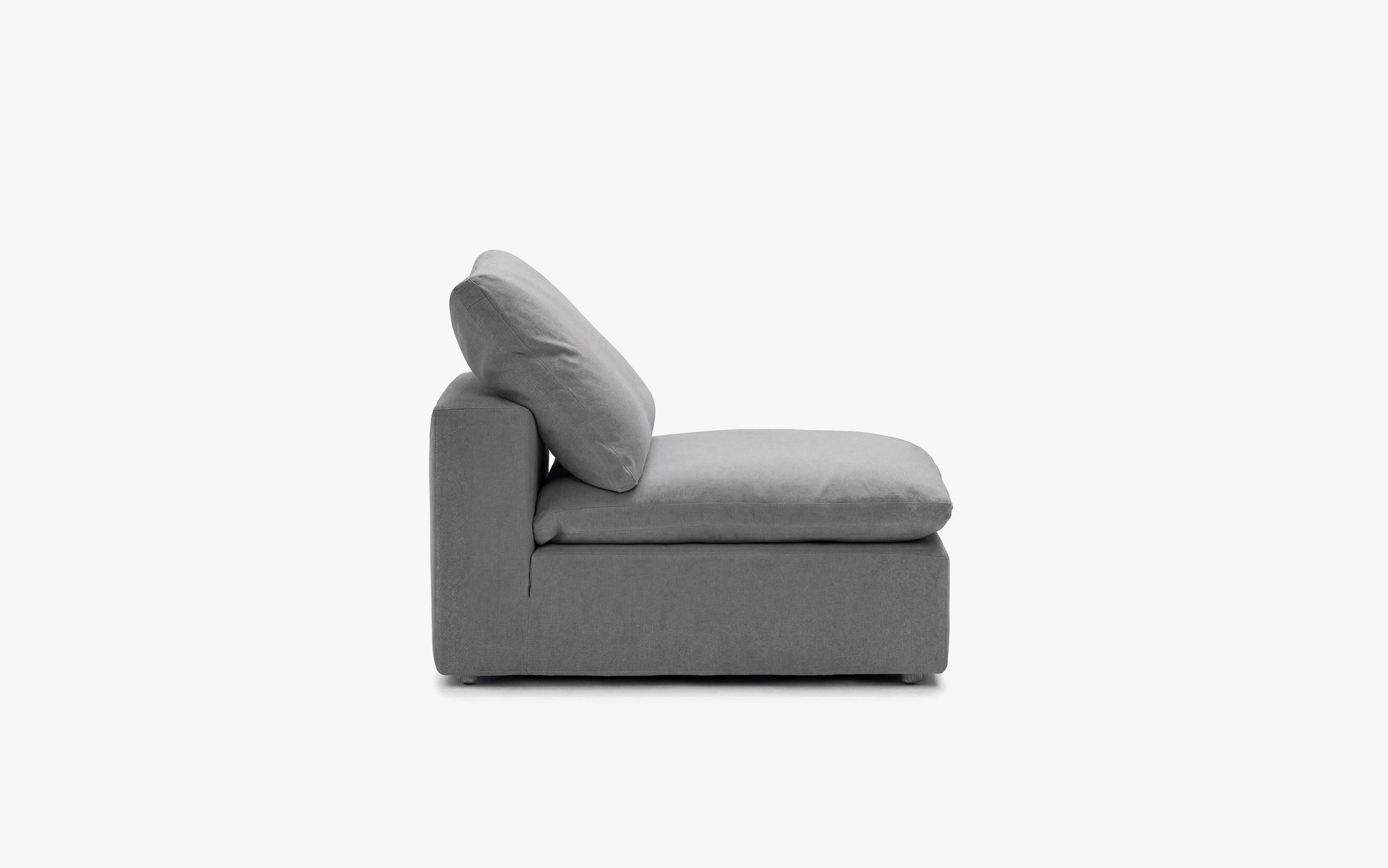 Armless anthracite sofa in a compact living room